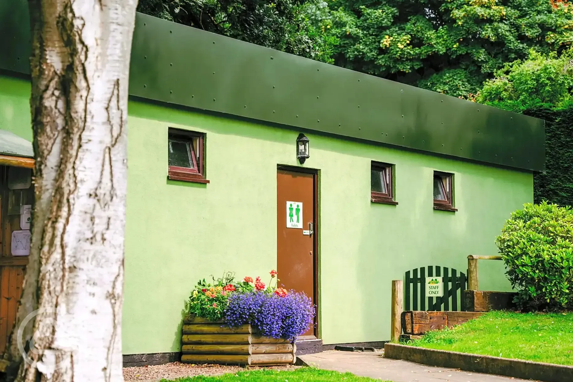 Facilities block with individual bathrooms