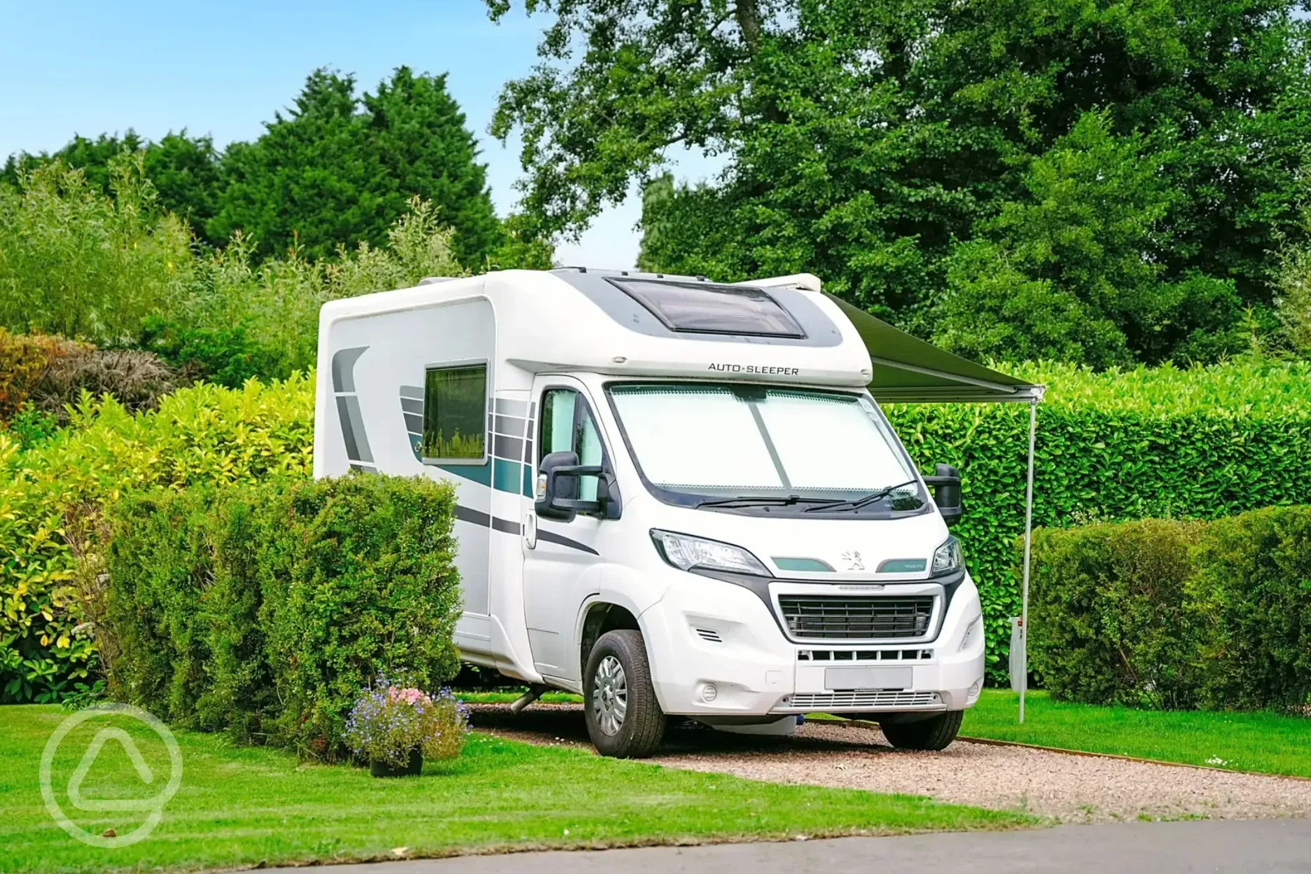 Electric hardstanding touring pitches with privacy hedging