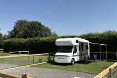 Enclosed hardstanding and grass pitch Enclosed hardstanding and grass pitch