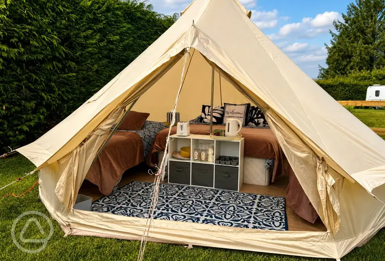 Bell tent exterior and interior at at Zeacombe House Caravan Park