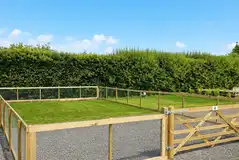 Enclosed hardstanding and grass pitch Enclosed hardstanding and grass pitch