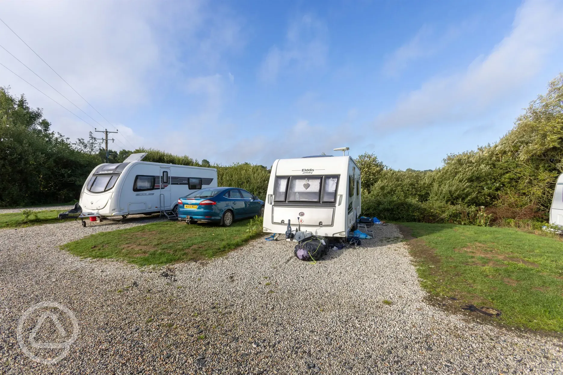 Fully serviced gravel touring pitches with car parking spaces