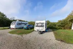 Fully serviced gravel touring pitches with car parking spaces