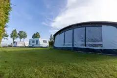 Caravans with awnings on electric grass pitches at Cornish Coasts Caravans with awnings on electric grass pitches at Cornish Coasts