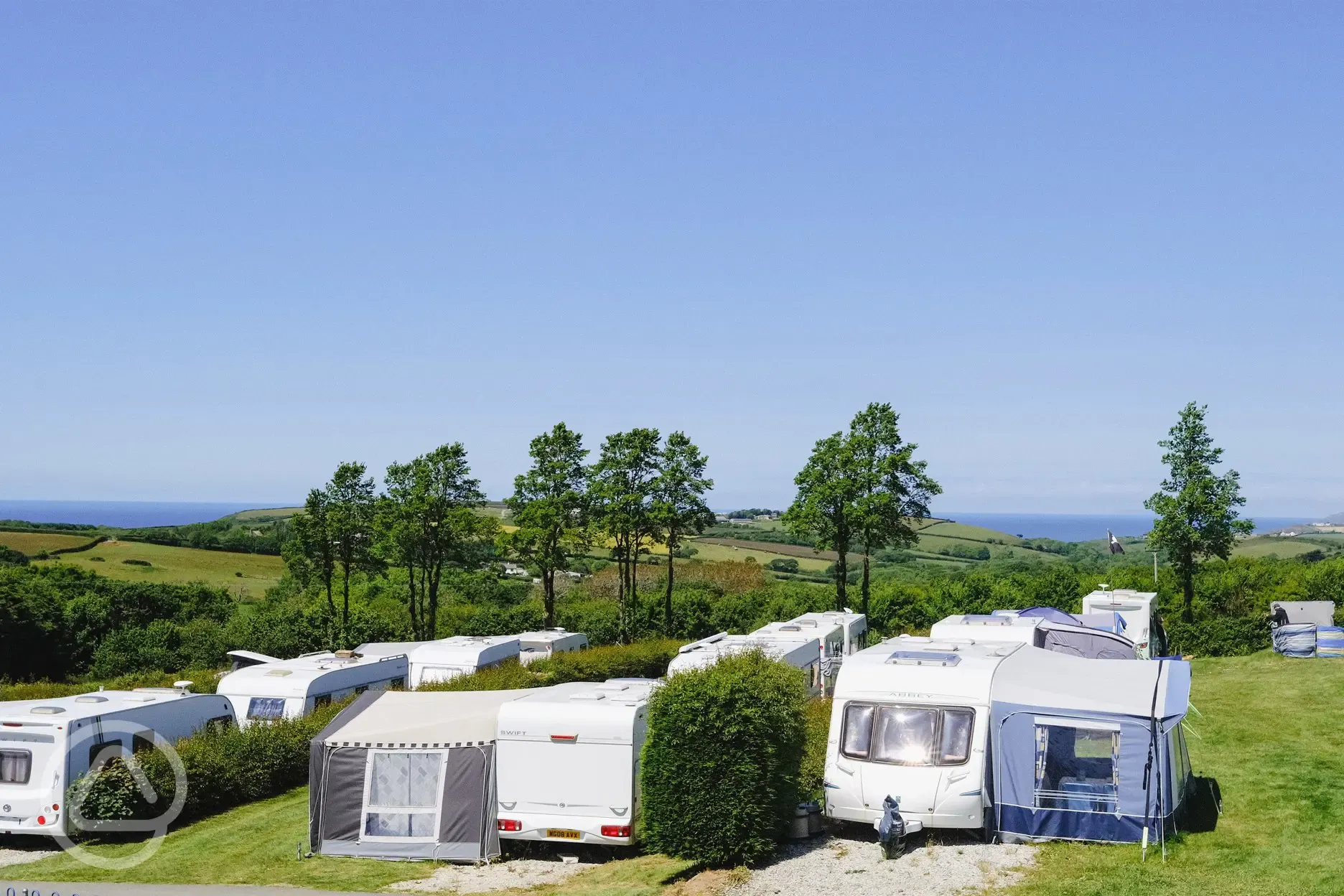 Electric grass and gravel touring pitches with sea views