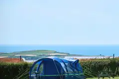 Tent on an Upper Meadow electric grass pitch 