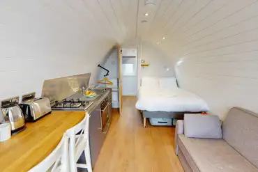 Glamping pod with a double bed, double sofa bed, kitchen and ensuite