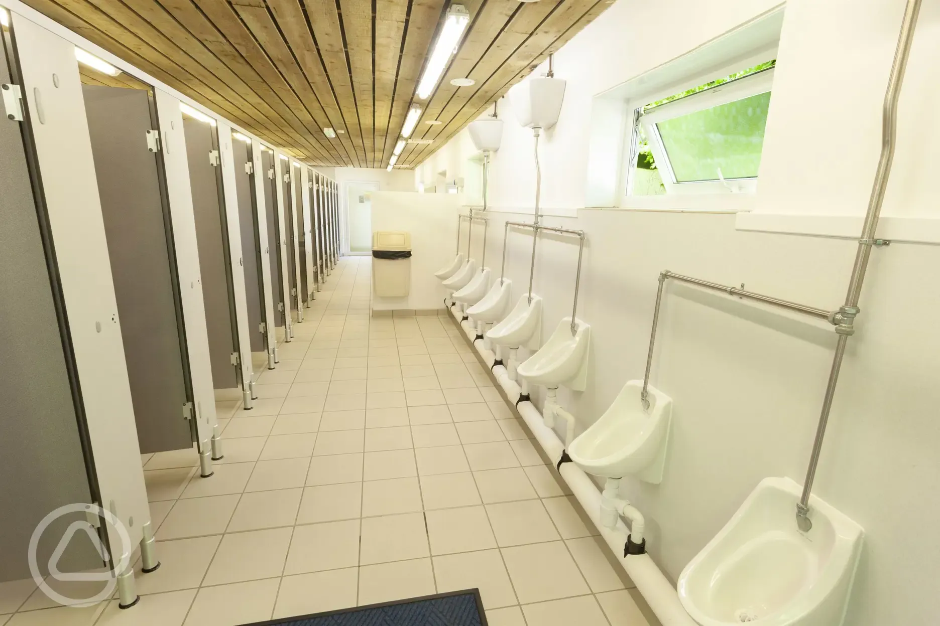 Facilities block interior with urinals and toilets