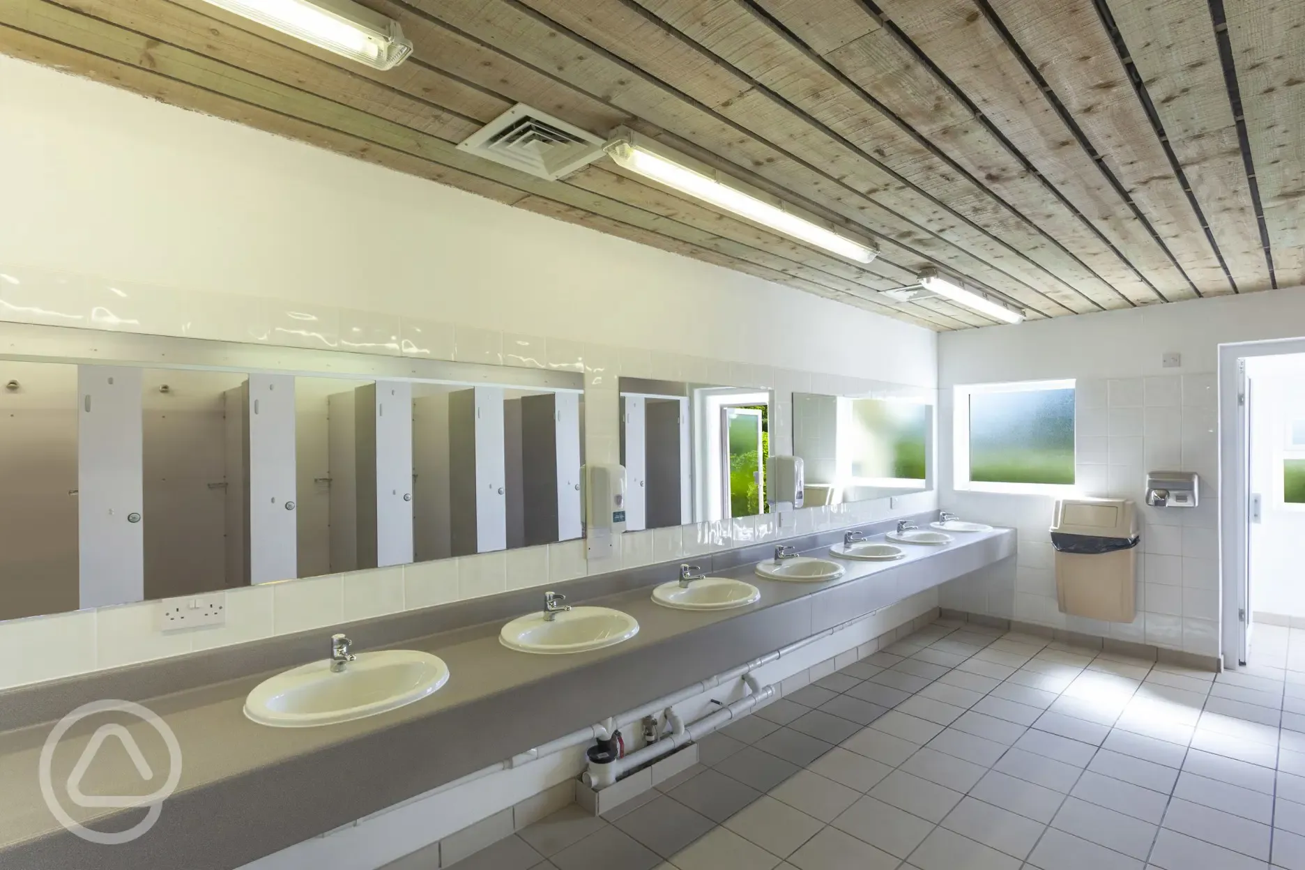 Facilities block interior with sinks and mirrors