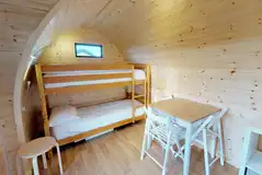 Camping pod with bunk beds and a seating area (bring or hire bedding)