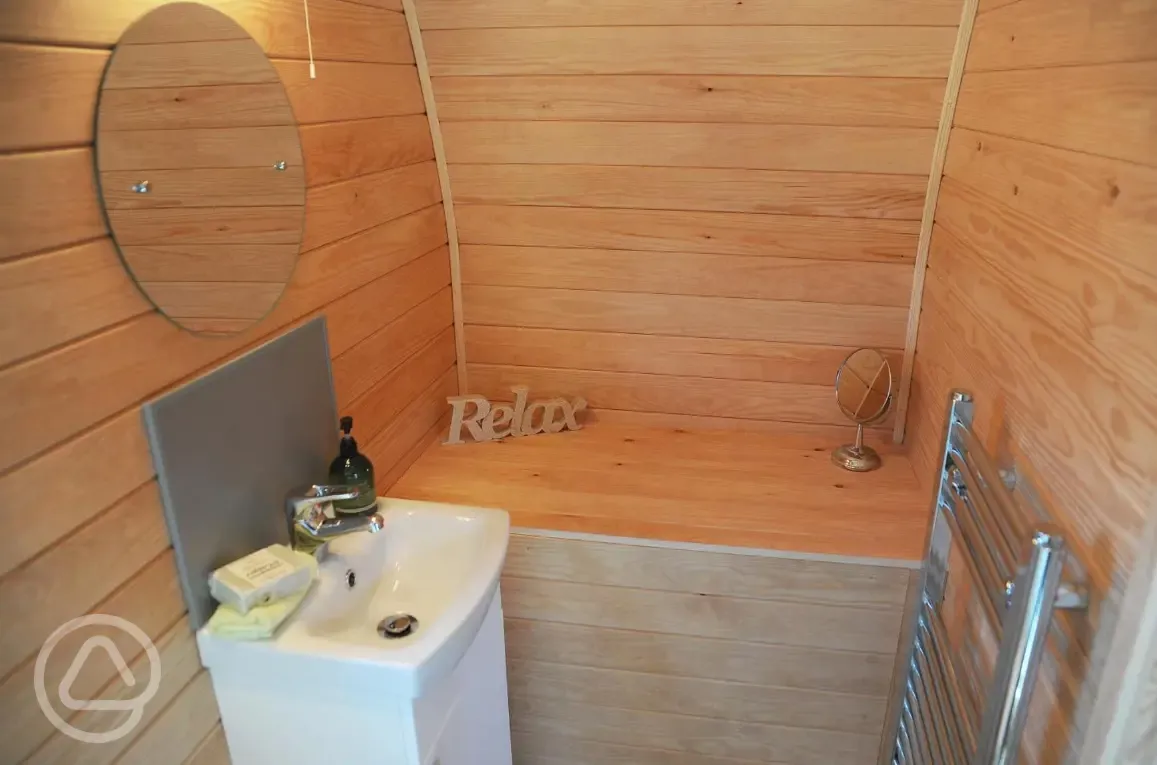 Mega pod ensuite toilet and sink (shared showers nearby)