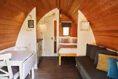 Mega pod with a double bed, double sofa bed, kitchenette and ensuite toilet