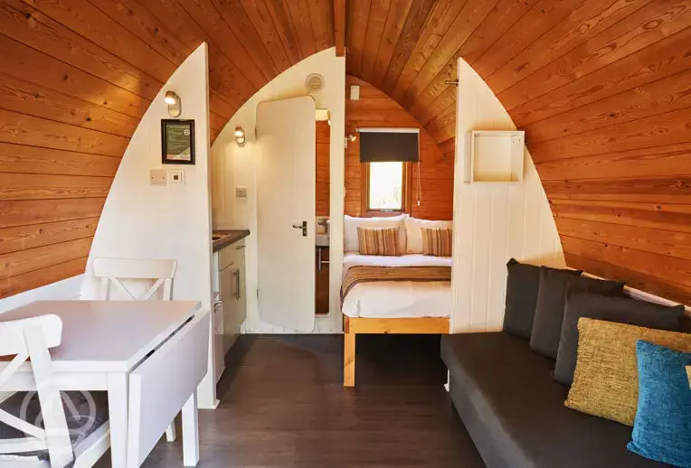 Mega pod with a double bed, double sofa bed, a kitchenette and ensuite toilet