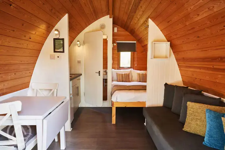 Mega pod with a double bed, double sofa bed, a kitchenette and ensuite toilet