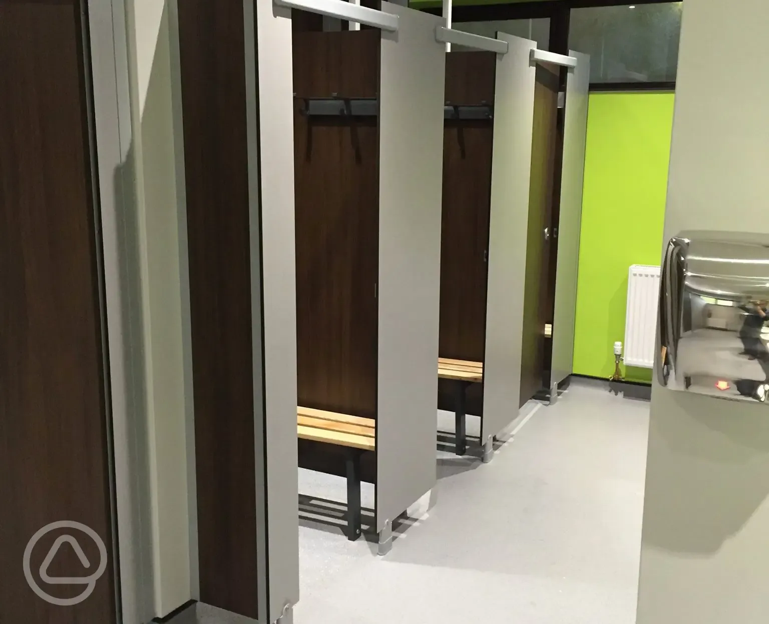 Showers with space for getting changed and benches
