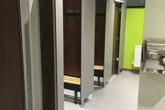 Showers with space for getting changed and benches