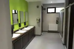 Modern toilet and shower blocks with hair dryers