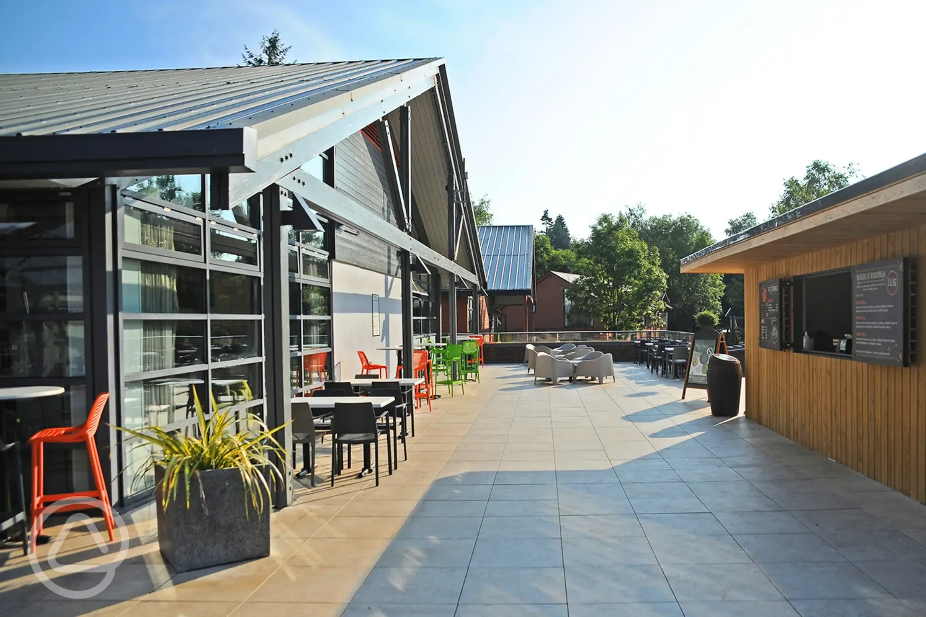 Terrace area with covered seating and a kiosk for drinks and treats