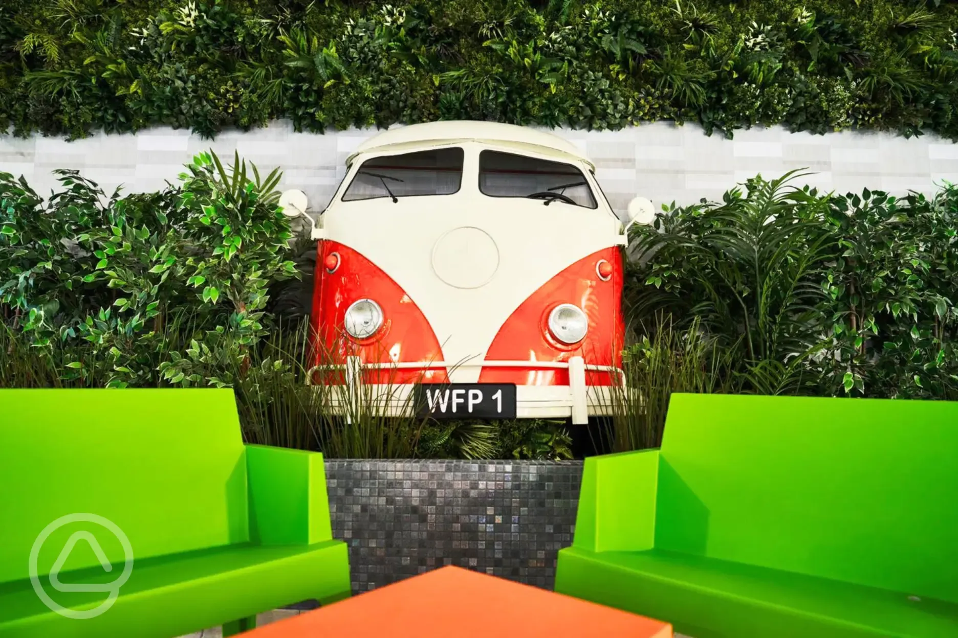 Seating in reception with a campervan wall feature
