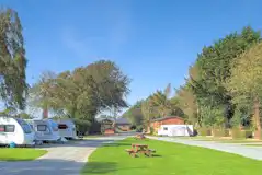 Fully serviced hardstanding touring pitches with grass areas between