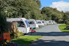 Touring pitches with gravel roads around the site Touring pitches with gravel roads around the site