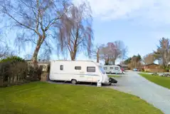 Fully serviced hardstanding touring pitches (5m x 7.5m) with grass areas between Fully serviced hardstanding touring pitches (5m x 7.5m) with grass areas between