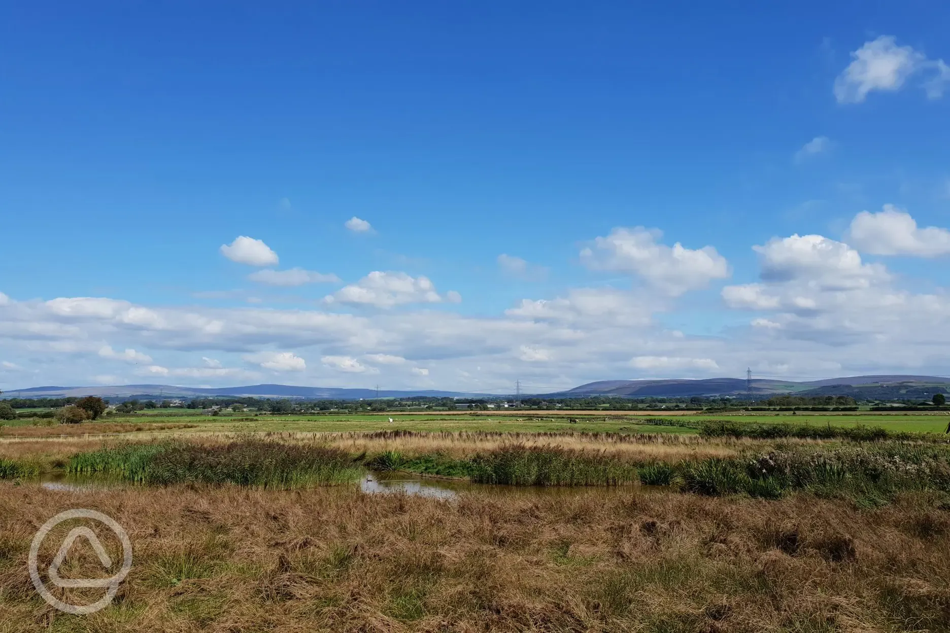 View across on-site nature reserve towards Forest of Bowland