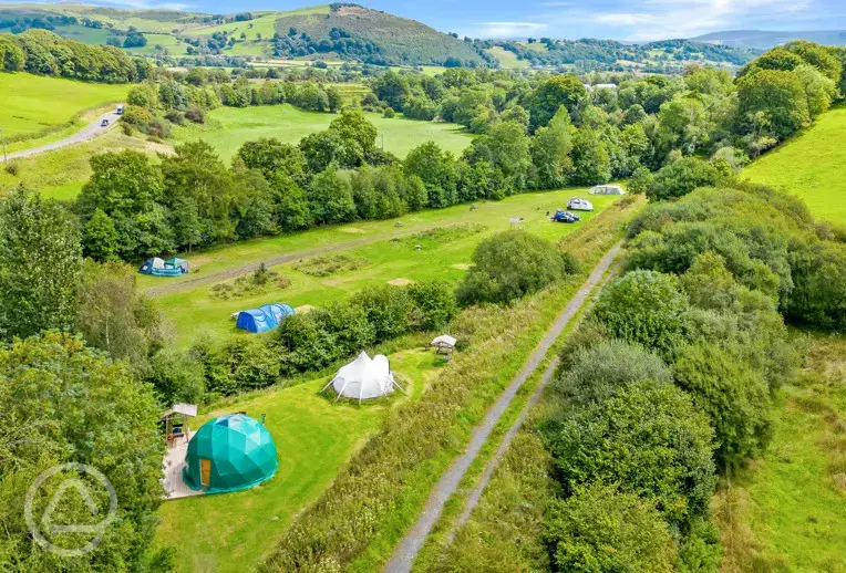 Aerial of glamping units and camping field