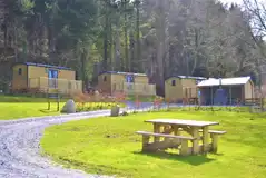 Ensuite shepherd's huts with wooden decks and electric hot tubs