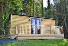 Shepherd's huts with a wooden deck area