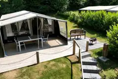 Isabella safari tent with a fire pit, outdoor seating and lighting
