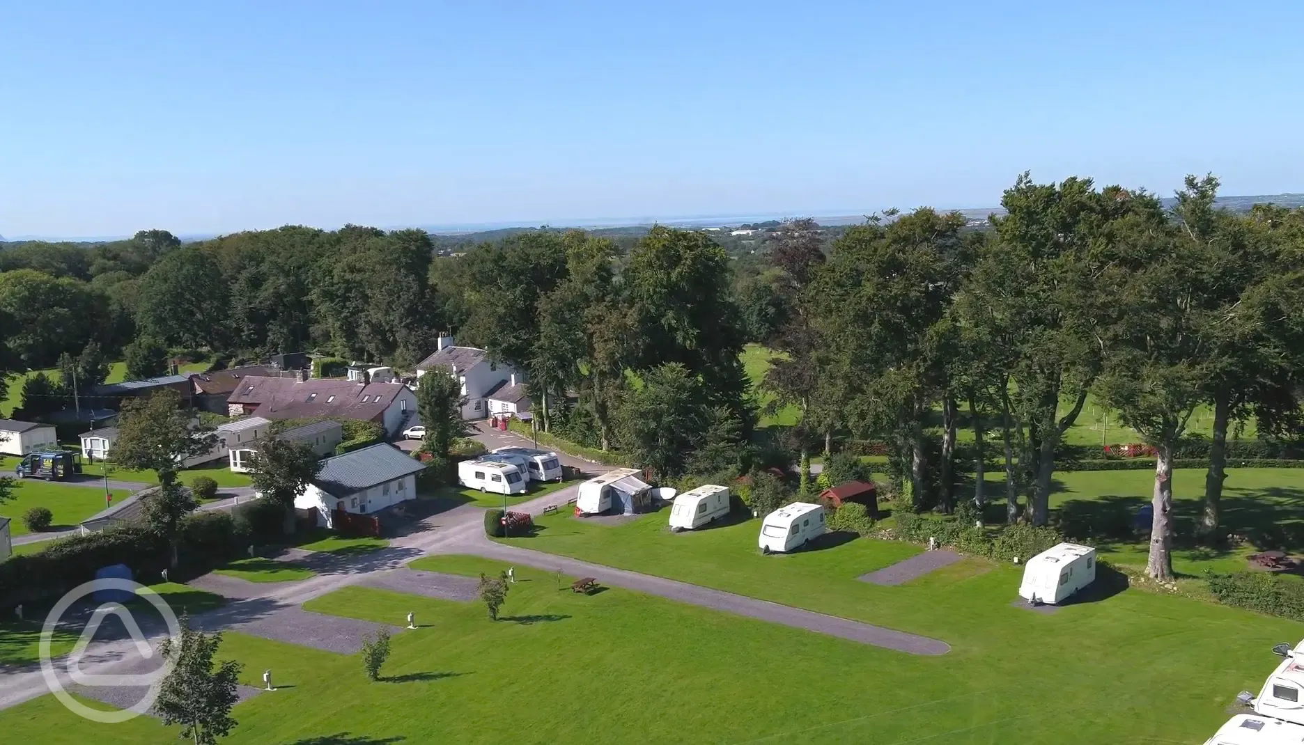 Aerial of the hardstanding pitches, each surrounded by a grass area
