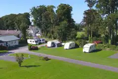 Hardstanding pitches with surrounding grass areas
