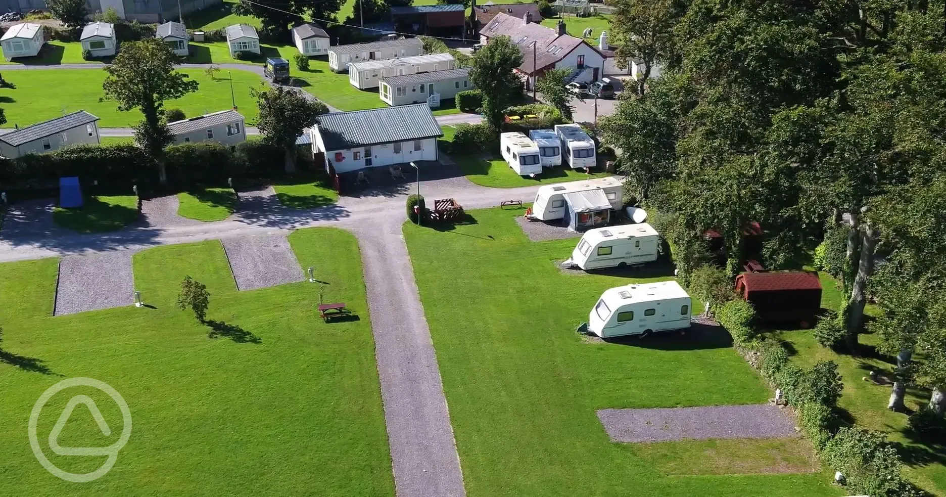 Aerial of the hardstanding pitches, backed by the camping pods
