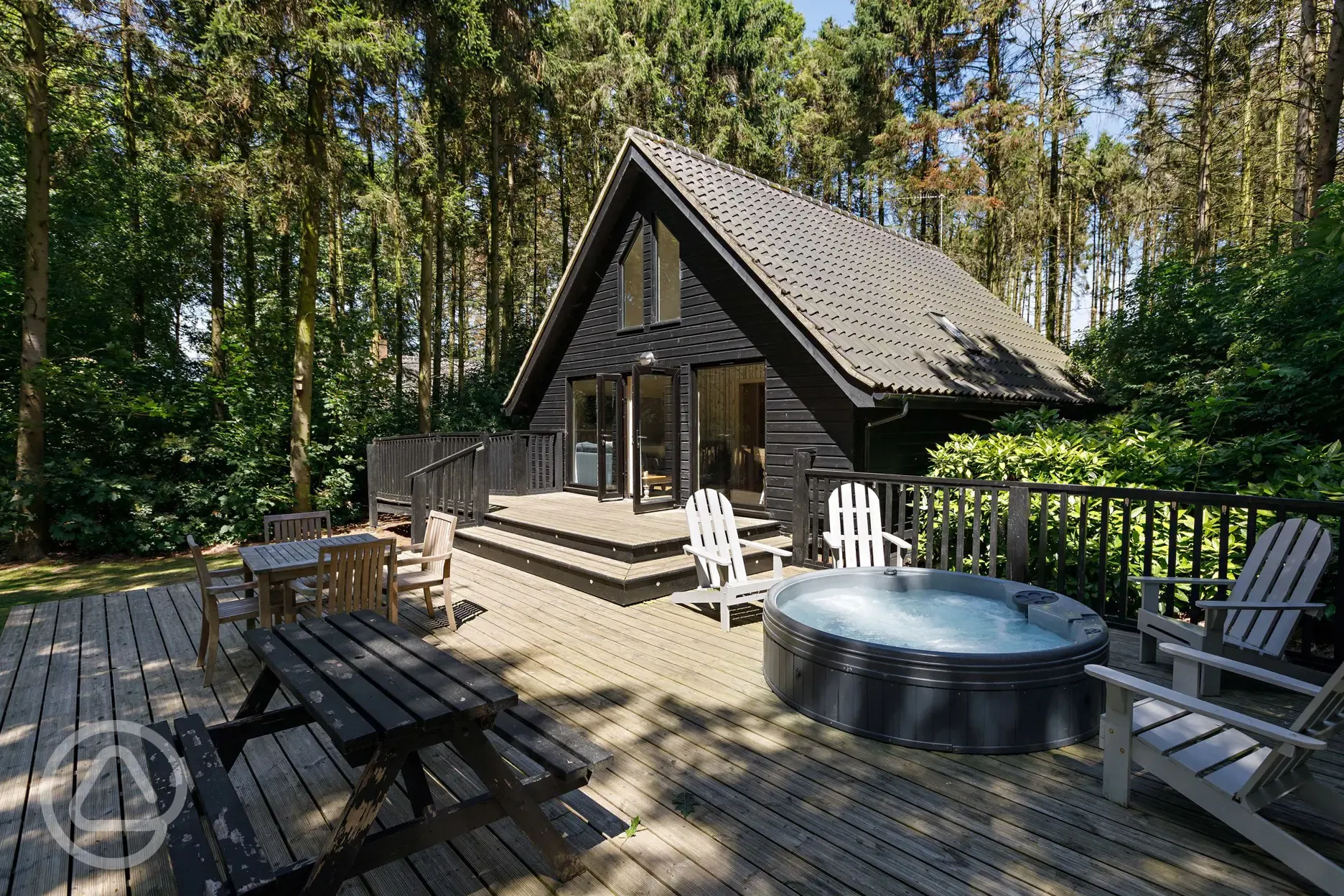 Pine lodges with outdoor furniture and private hot tub