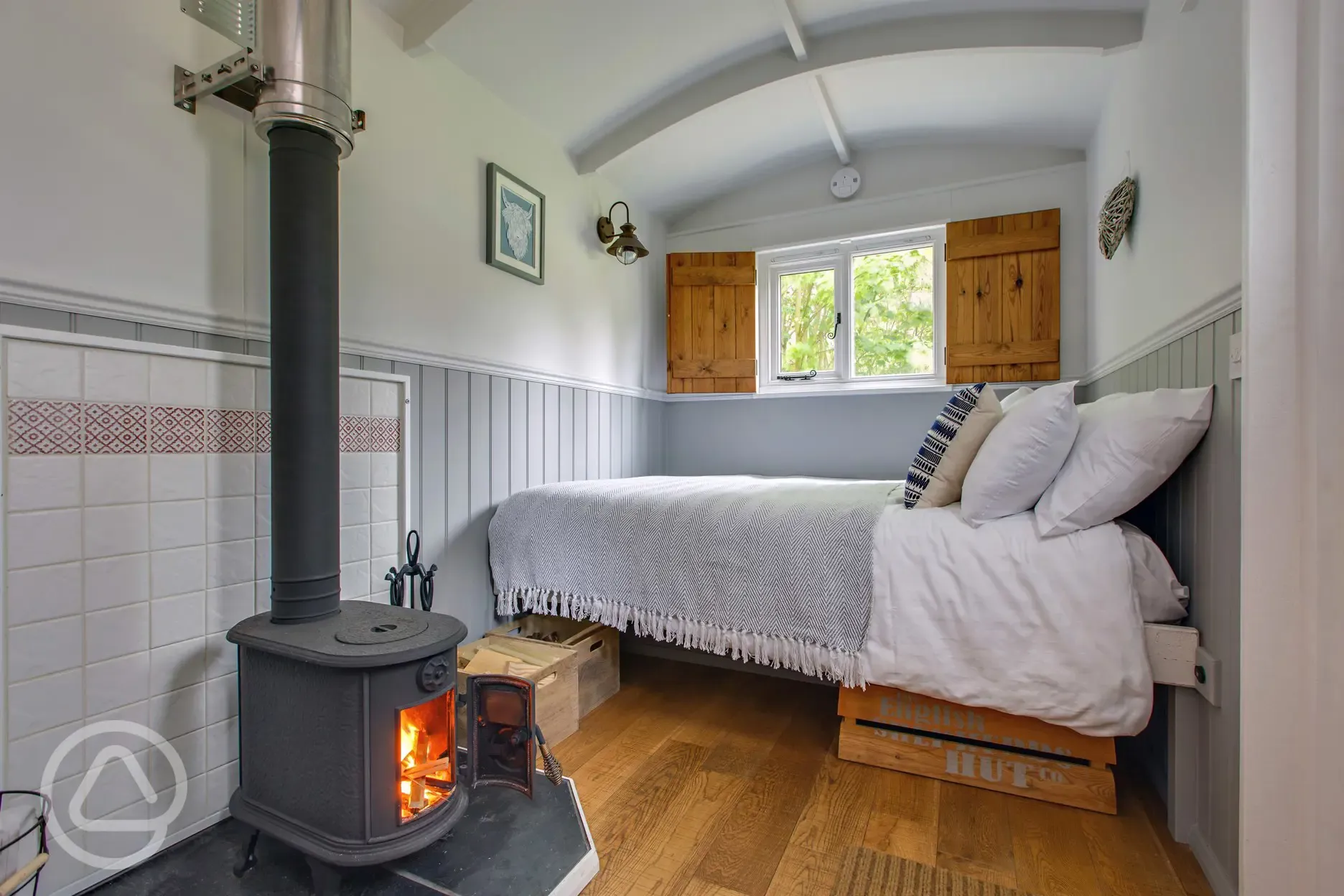 Tilly shepherd's hut double bed and wood burner