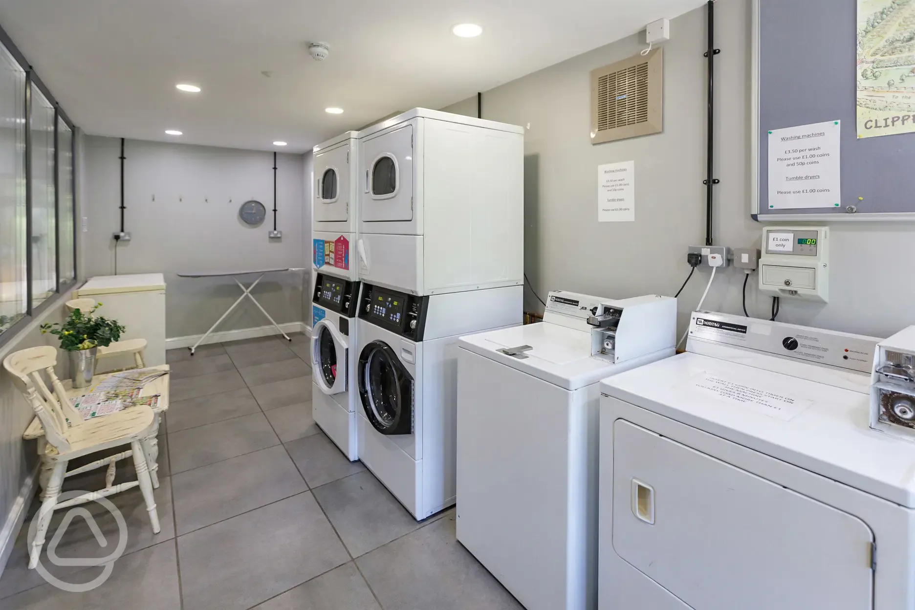 Laundry room with coin-operated washing machines and tumble dryers