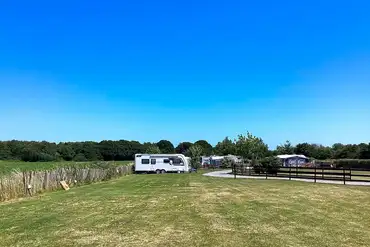 Caravans on electric grass pitches (8m x 8m) at Rose Farm Touring Park