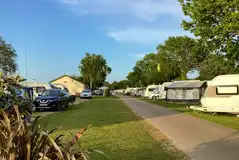 Caravans on electric grass pitches (8m x 8m) at Rose Farm Touring Park