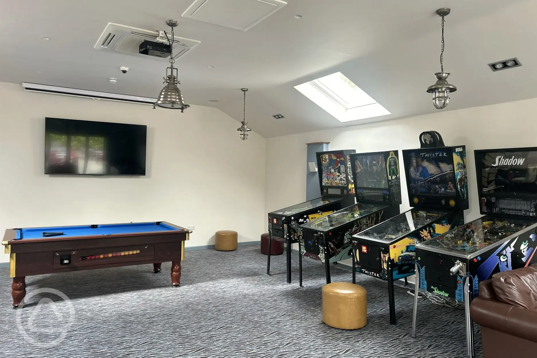 Games room with arcade games and pool