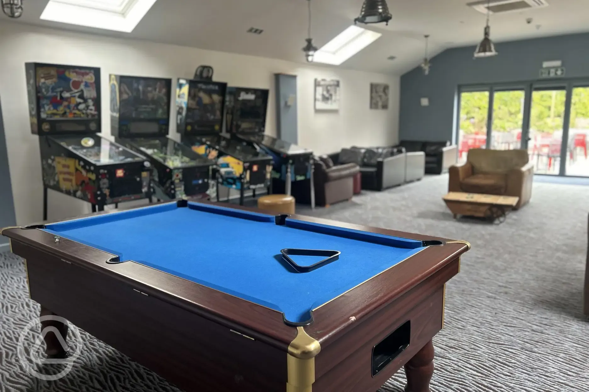 Games room with arcade games and pool