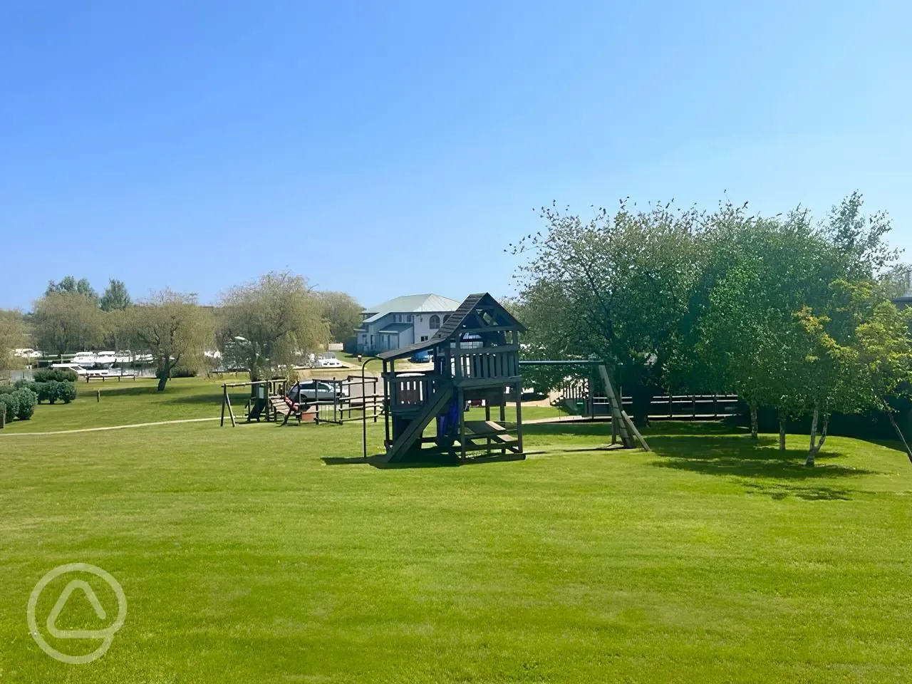 Children's play area with a small wooden climbing frame