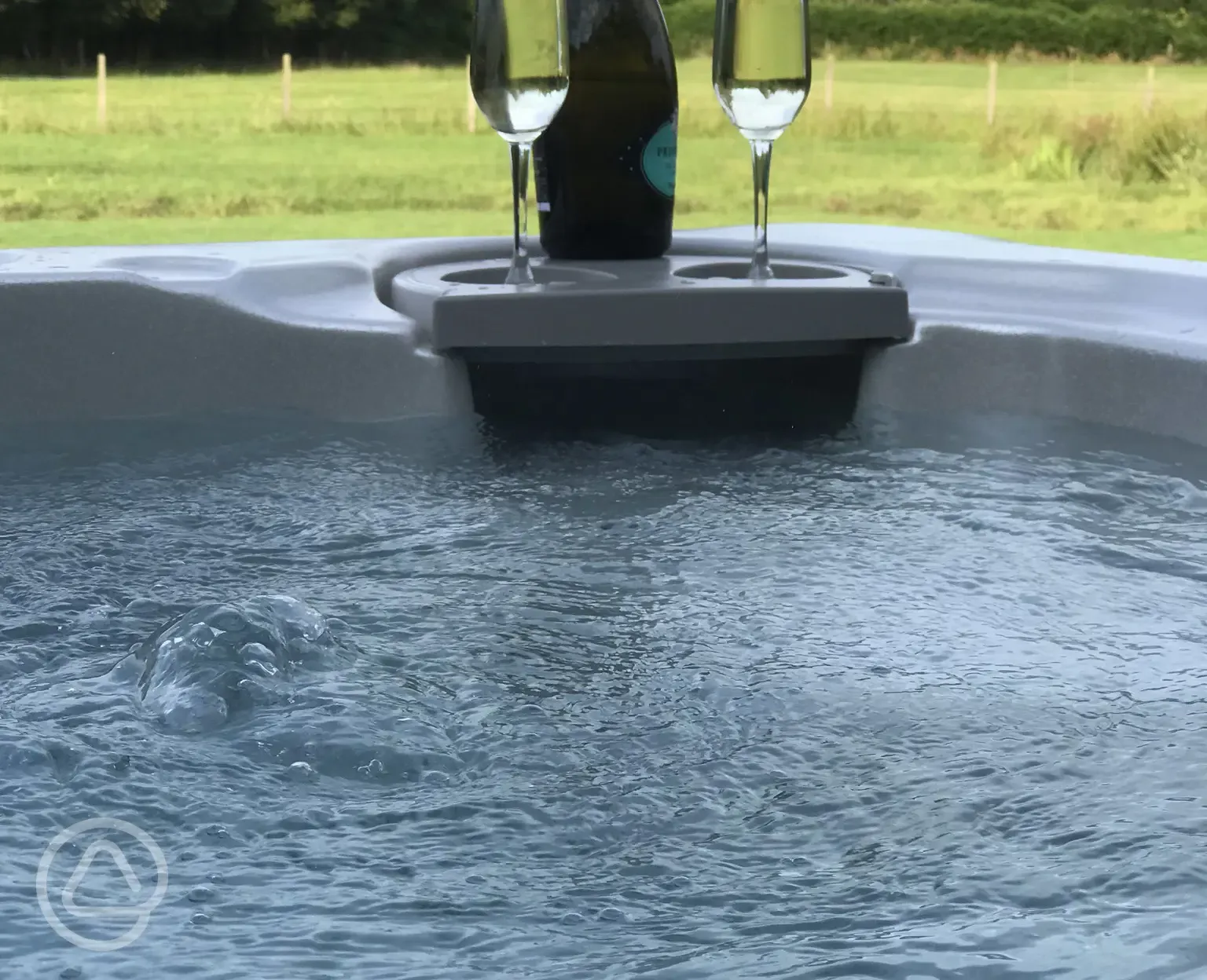 Enjoy a glass of fizz from the Point House jacuzzi hot tub