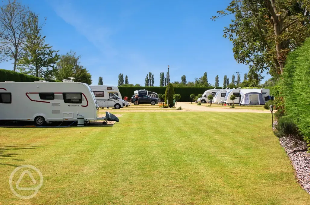 Electric hardstanding and grass pitches