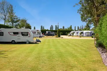 Electric hardstanding and grass pitches