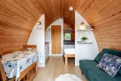 Glamping pod dining area, double bed and double sofa bed (pod one) Glamping pod dining area, double bed and double sofa bed (pod one)