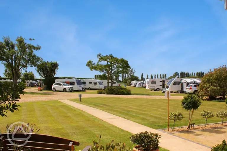 Electric hardstanding and grass pitches