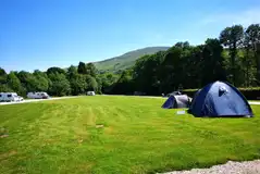 Non electric grass pitches at Bunroy Park overlooking Scottish mountains Non electric grass pitches at Bunroy Park overlooking Scottish mountains