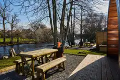 Outdoor seating area and fire pit with river views Outdoor seating area and fire pit with river views