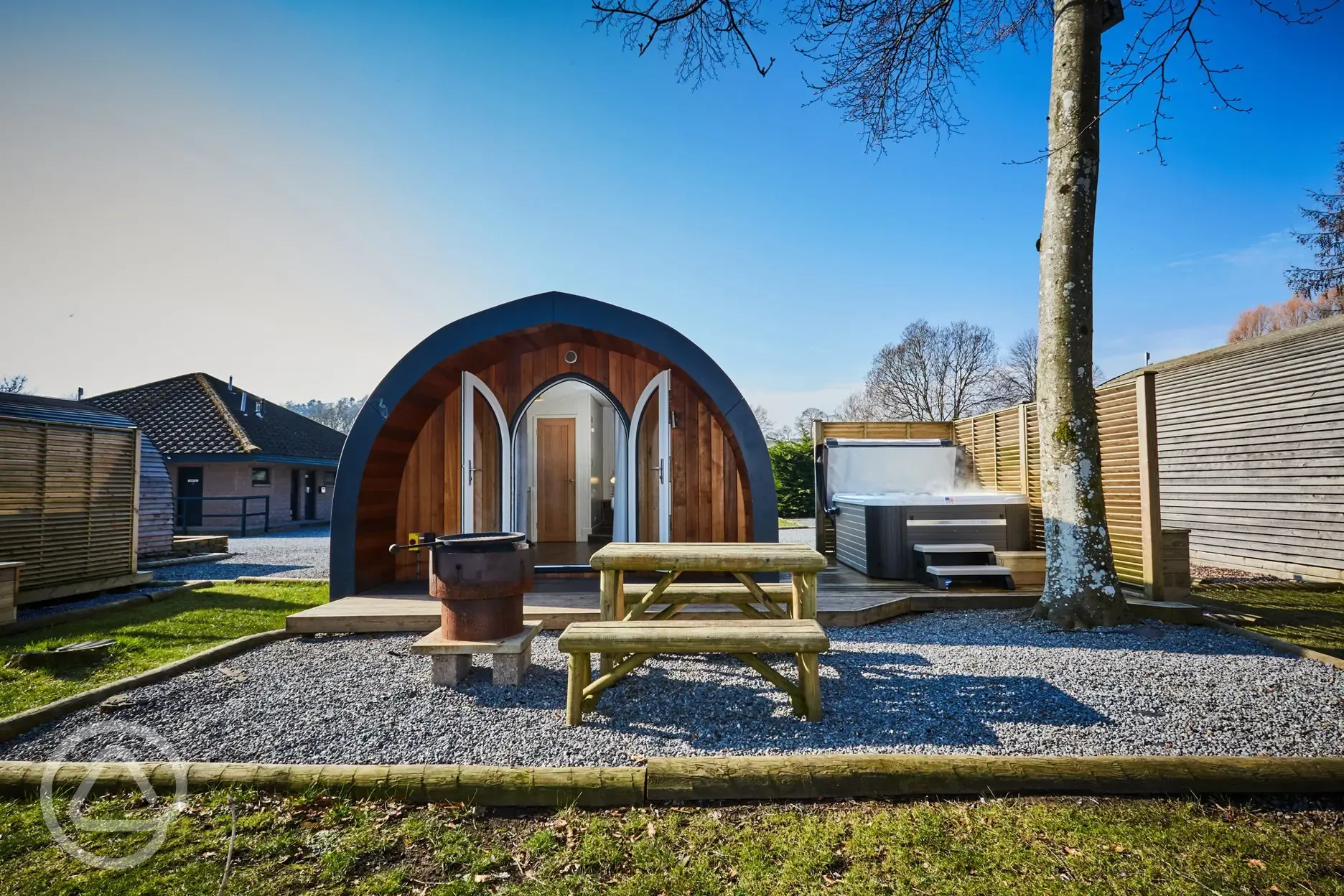 Pod with outside seating and hot tub